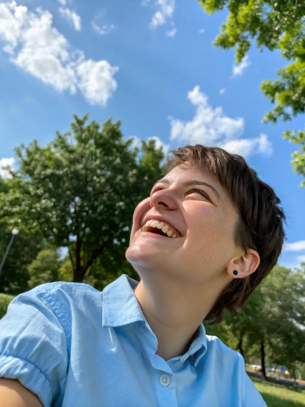 A healthy individual smiling confidently, representing the peace of mind that comes with having adequate health insurance coverage through Jess Multiservices.